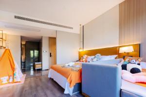 Voodi või voodid majutusasutuse Dujiangyan Yuandong Yaju Hotel toas