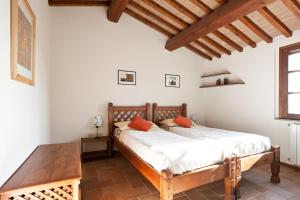 Un pat sau paturi într-o cameră la Casale Pundarika