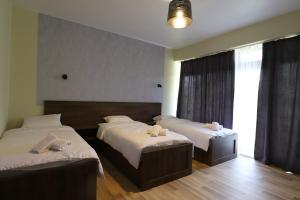 Postel nebo postele na pokoji v ubytování Green Hotel Tskaltubo