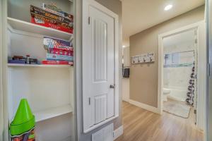 a hallway with a white door and a bathroom at Tempe Joy House With Backyard Sanctuary By Asu in Tempe +40 photos