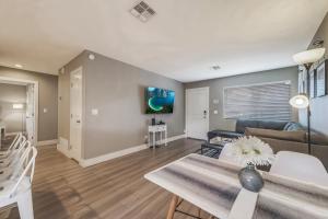 a living room with a couch and a table at Tempe Joy House With Backyard Sanctuary By Asu in Tempe