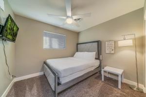 a bedroom with a bed and a ceiling fan at Tempe Joy House With Backyard Sanctuary By Asu in Tempe
