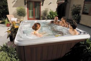 a group of people in a hot tub at 70 percent Off Luxurious Hot Tub,Sauna, 2000Sqft of Private in Vaughan