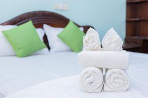 Postel nebo postele na pokoji v ubytování Asian Rooms Colombo 14