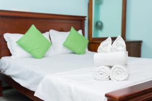 Postel nebo postele na pokoji v ubytování Asian Rooms Colombo 14