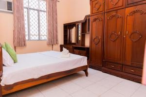 Postel nebo postele na pokoji v ubytování Asian Rooms Colombo 14