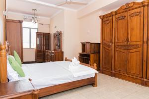 Postel nebo postele na pokoji v ubytování Asian Rooms Colombo 14
