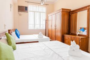Postel nebo postele na pokoji v ubytování Asian Rooms Colombo 14