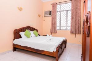 Postel nebo postele na pokoji v ubytování Asian Rooms Colombo 14