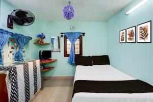 Ένα ή περισσότερα κρεβάτια σε δωμάτιο στο Hotel O PARAM HOMESTAY