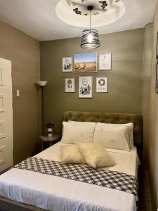 a bedroom with a bed with a pillow on it at Country Home Resort in Oslob