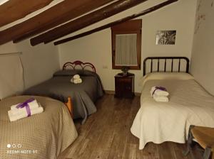 Postel nebo postele na pokoji v ubytování Casa Azafrán