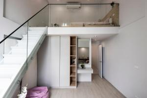 a room with stairs leading up to a loft at TownHouse7 2BR MonkeyHill in Ban Sam Kong +60 photos