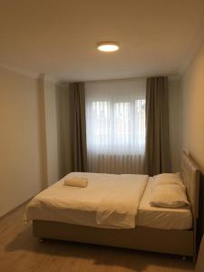 Postel nebo postele na pokoji v ubytování Fmy Apart Hotel