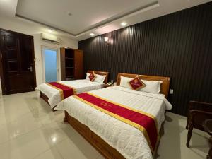 Postel nebo postele na pokoji v ubytování Gia Nguyen Hotel Vung Tau