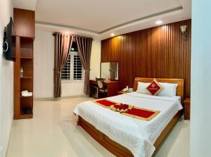 Postel nebo postele na pokoji v ubytování Gia Nguyen Hotel Vung Tau