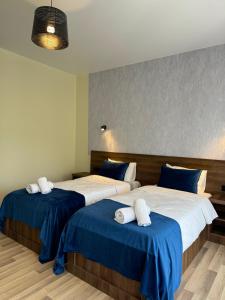 Postel nebo postele na pokoji v ubytování Green Hotel Tskaltubo