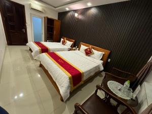 Postel nebo postele na pokoji v ubytování Gia Nguyen Hotel Vung Tau