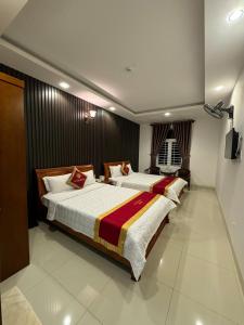 Postel nebo postele na pokoji v ubytování Gia Nguyen Hotel Vung Tau