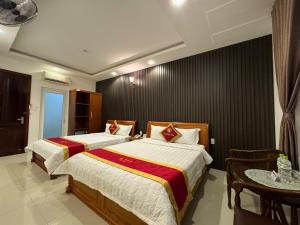 Postel nebo postele na pokoji v ubytování Gia Nguyen Hotel Vung Tau