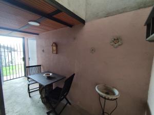 a room with a table and a sink on a wall at Casa rural Ca l'Antón in Sant Miquel de Campmajor