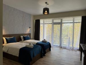 Postel nebo postele na pokoji v ubytování Green Hotel Tskaltubo + 37 fotografií