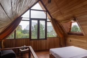 Postel nebo postele na pokoji v ubytování Refresh Inn Ella + 37 fotografií