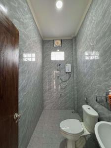 a bathroom with a toilet and a sink at Utopia house-luang prabang琅勃拉邦乌托邦庭院 in Luang Prabang +24 photos