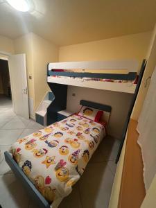 a small bedroom with a bunk bed and a bunk bedsheet at casa Olivieri in Carisolo +2 photos
