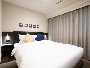 Postel nebo postele na pokoji v ubytování Hotel Shuranza Chiba
