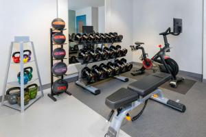 a gym with bikes and exercise equipment in a room at Homewood Suites by Hilton Bonita Springs, FL in Bonita Springs