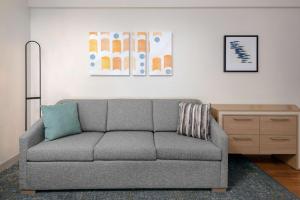 a living room with a couch and a table at Homewood Suites by Hilton Bonita Springs, FL in Bonita Springs