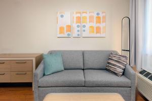 a living room with a couch and a table at Homewood Suites by Hilton Bonita Springs, FL in Bonita Springs