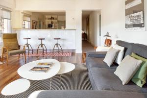a living room with a couch and a table at ATERIAN. SANZ ENEA in Zarautz