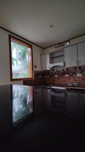 a kitchen with a sink and a window in it at Sanctuary Resort Hunza in Hunza Valley +33 photos