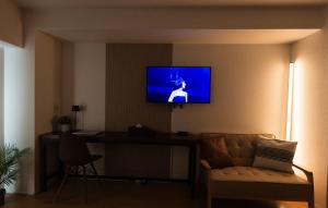TV a/nebo společenská místnost v ubytování b&天下茶屋店