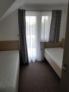 En eller flere senge i et værelse på Villa Natali Podhájska + 21 billeder