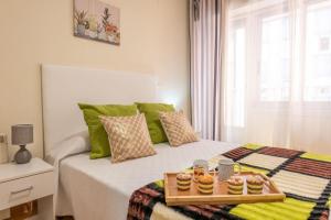 A bed or beds in a room at Apartamento Centro Santiago