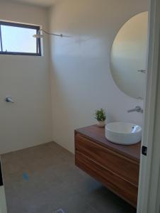 a bathroom with a sink and a mirror at The Shack in Walker Flat +20 photos