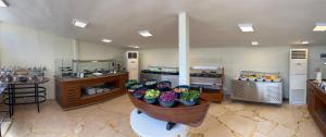 a kitchen with a bunch of vegetables in a basket at Sheraton Soma Bay Resort in Hurghada