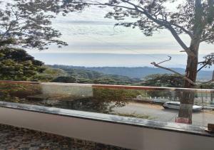 a view of a river from a balcony at ALPINE BNB Dharmshala in Dharamshala +11 photos
