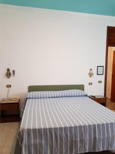 Postel nebo postele na pokoji v ubytování Meublè Andrea Doria