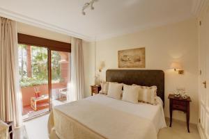 Postel nebo postele na pokoji v ubytování Vasari Resort + 35 fotografií