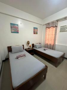 Postel nebo postele na pokoji v ubytování Brielles Travellers Inn