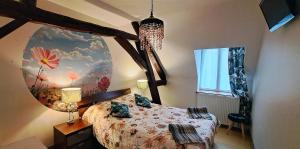 a bedroom with a bed and a large mirror at Domaine de montboulon in Saint-Georges-sur-Baulche