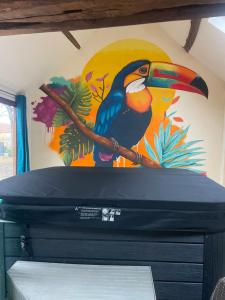 a painting of a bird sitting on a branch at Domaine de montboulon in Saint-Georges-sur-Baulche