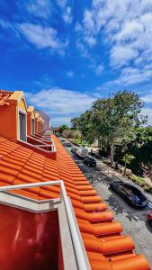 an orange roof of a building with cars parked on a street at Sea Garden Peniche in Peniche