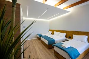 Voodi või voodid majutusasutuse Golemi Lux Hotel toas