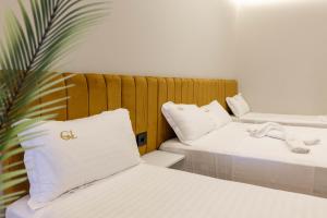 Voodi või voodid majutusasutuse Golemi Lux Hotel toas