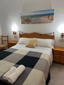 Postel nebo postele na pokoji v ubytování Apartamentos Mar i Vent Puerto de La Savina Formentera + 37 fotografií